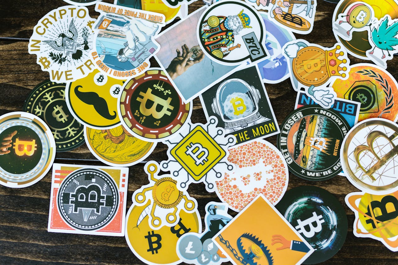 about-me-01 Colorful collection of Bitcoin-themed stickers on a wooden background, ideal for cryptocurrency concepts.